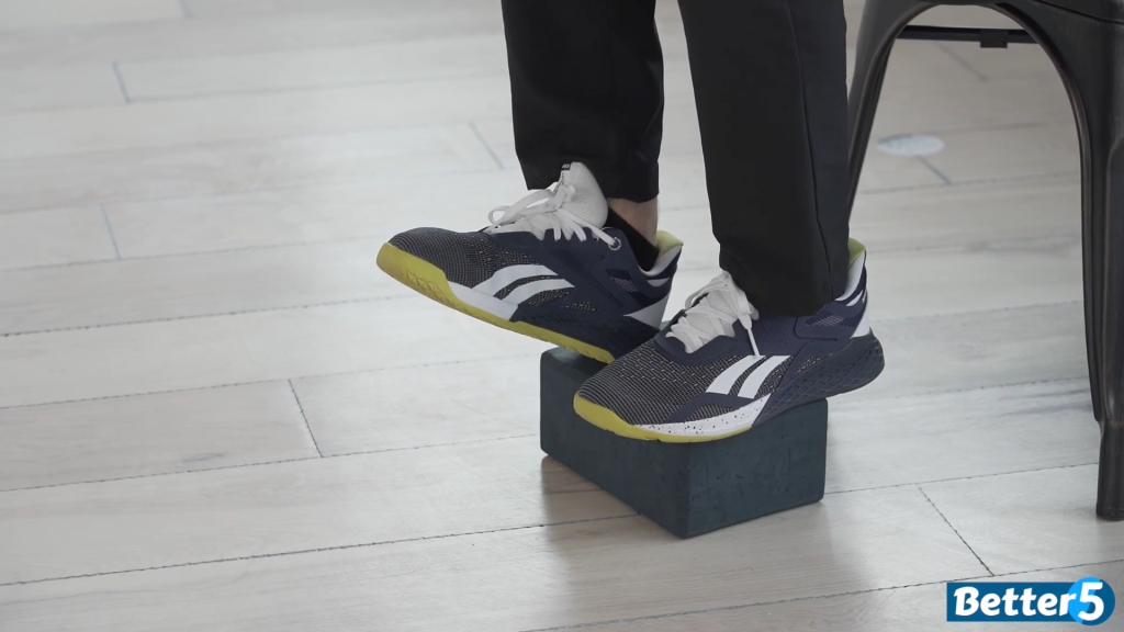 Yoga block toe lifts exercise, showing feet on a yoga block lifting onto tiptoes, part of the 10 exercises to prevent falls.