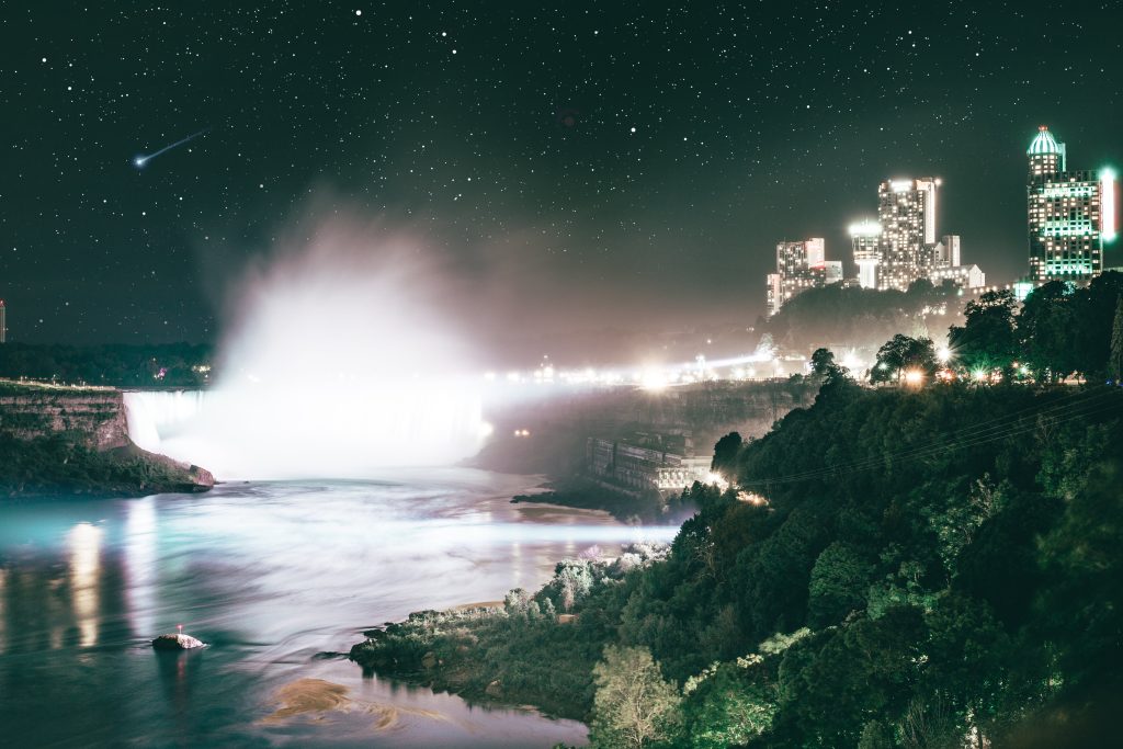 Night time picture of Niagara Falls and city skyline on a starry night