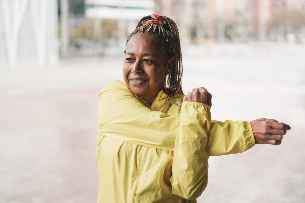 Senior woman exercising to reduce bloating in menopause