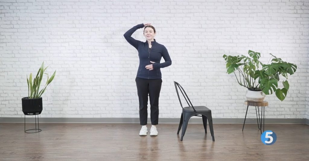 Female instructor doing gentle exercises at home