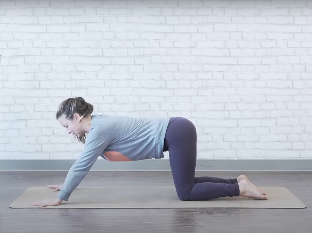 Demonstrating the praise-the-ground bed exercise - starting position