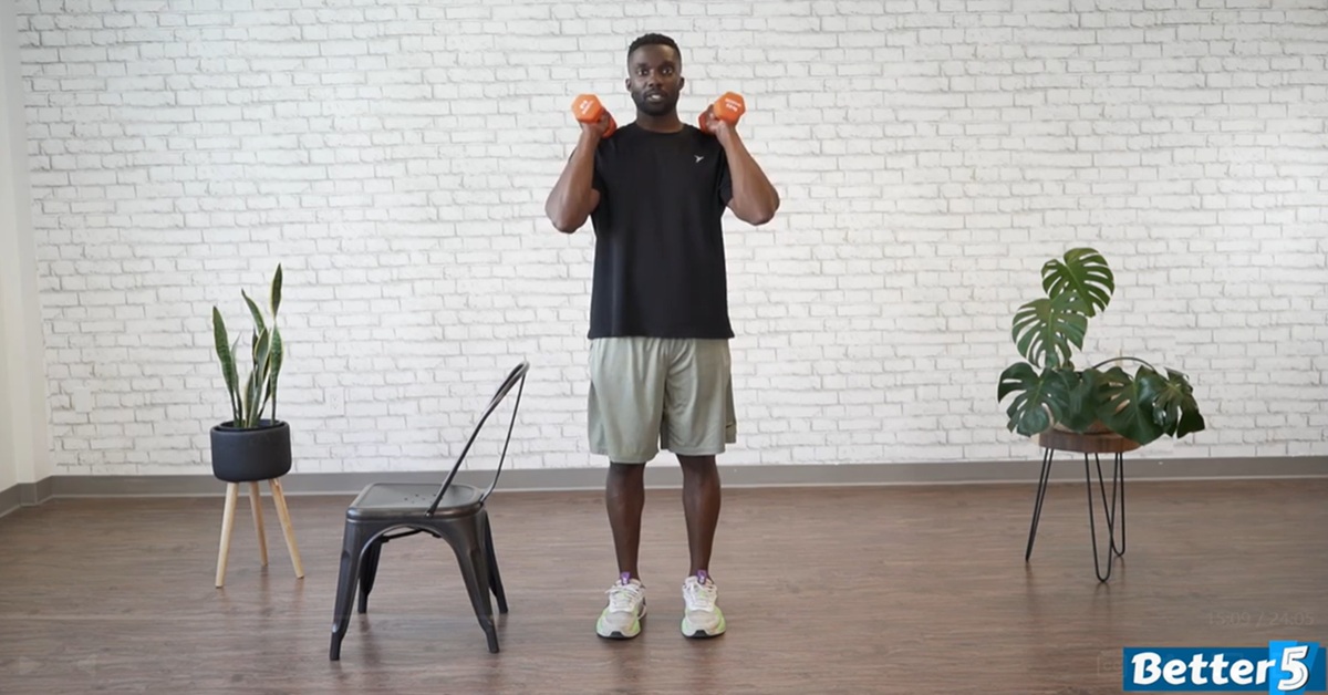 instructor doing strength workout for seniors 