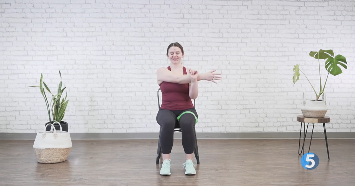 instructor performing breathing at home excercise