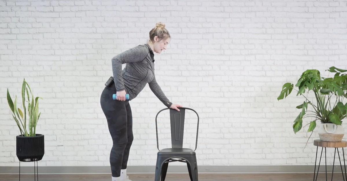 instructor demonstrating bent over row excercise for seniors