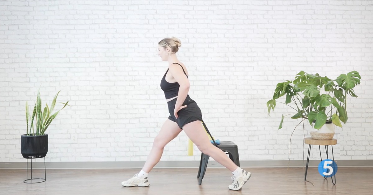 instructor doing hip excercises for seniors