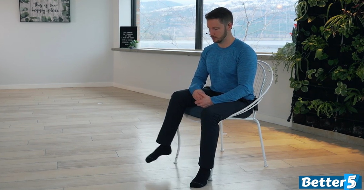 instructor doing knee strength excercise for seniors