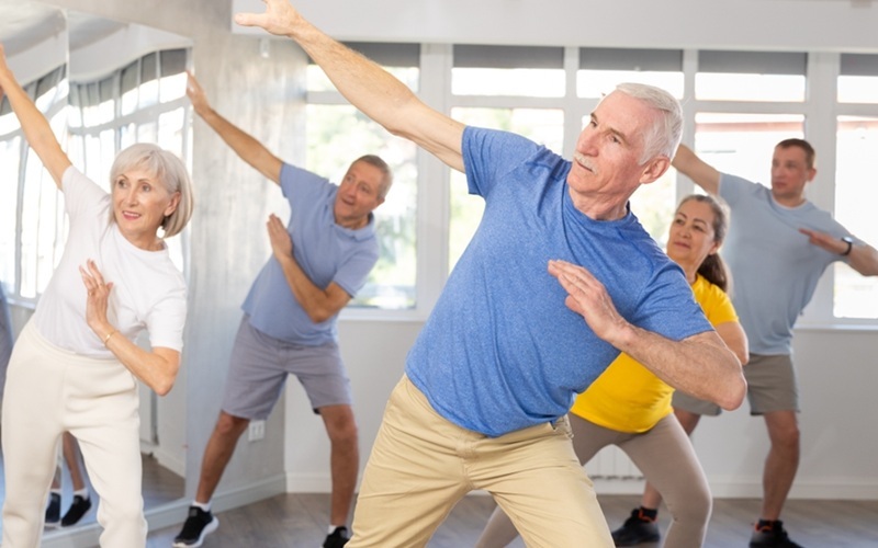 group of seniors doing indoor workout feature