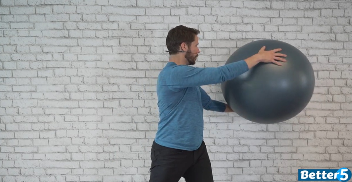 instructor performing low impact excercise for seniors