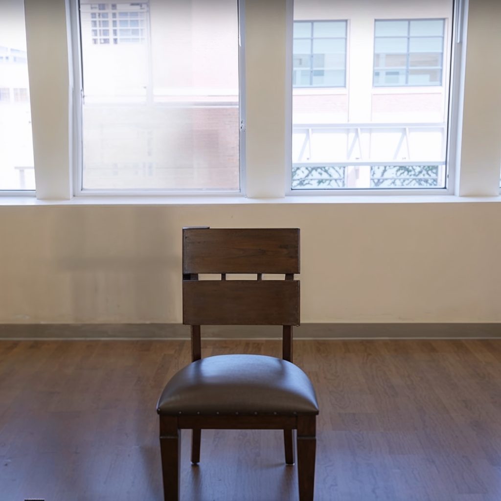 Picture of a sturdy wooden chair, a must-have equipment for at-home senior workouts that help with balance & stability exercises