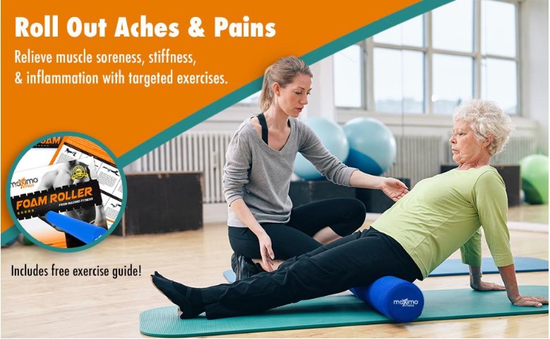 An elderly lady getting instruction from a trainer as she uses a foam roller
