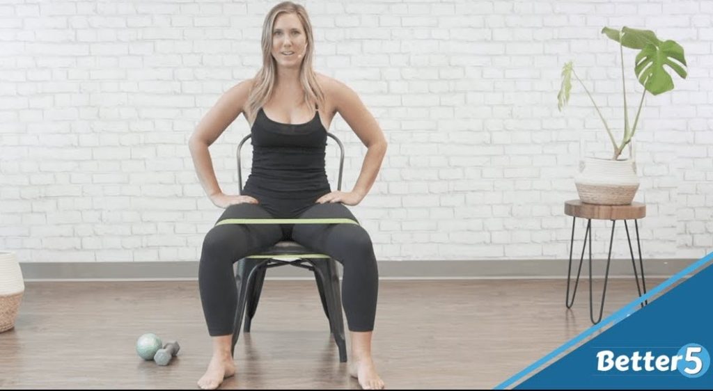 Woman shows how to perform seated clamshell exercise, for seniors