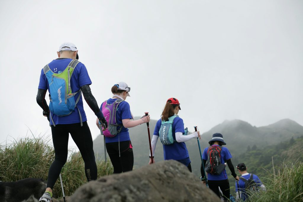 A group of hikers on a trail, showing that hiking for seniors can be more exciting when done in groups.